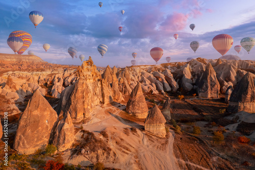 Aerial top view landscape Cappadocia stone and old cave house in Goreme national park Turkey Sunset sunlight