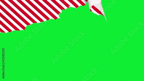 Christmas gift  paper is torn over green background. Stop Motion Animation. Mockup for discounts, text etc
