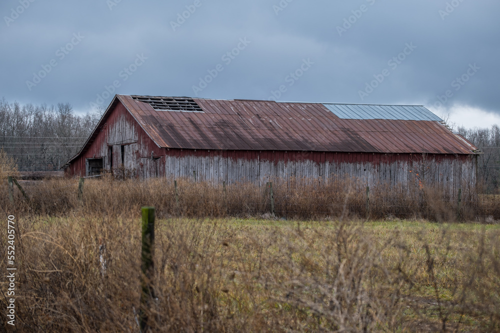 Abandoned barn in a field