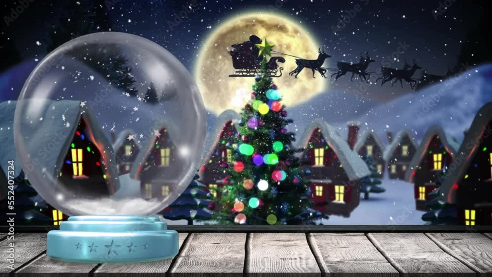 Animation of christmas snow globe with full moon and snow falling in winter scenery Animation of christmas snow globe with full moon and snow falling in winter scenery