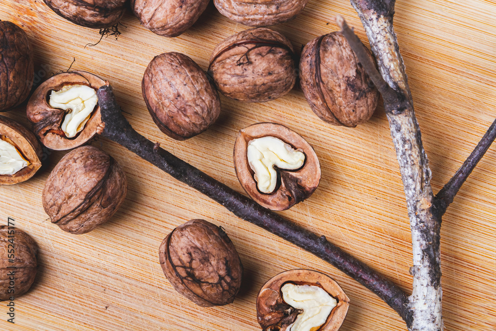 Walnut. Half walnut on natural background. Inshell nuts. Copyspace. Walnut. Half walnut on natural background. Inshell nuts. Copyspace.