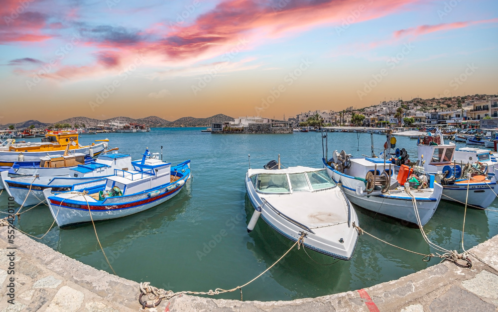 Fototapeta premium Colorful fishing boats in the harbour Elounda, Crete, Greece