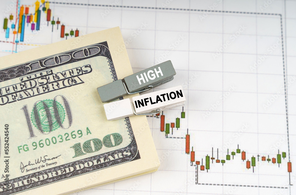 On the charts of quotations are dollars, clothespins with the inscription - high inflation