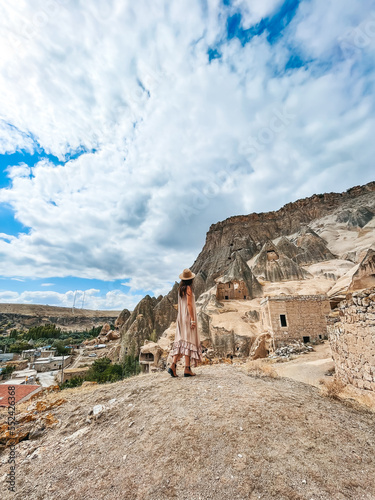 Young woman touring cave church in Cappadocia