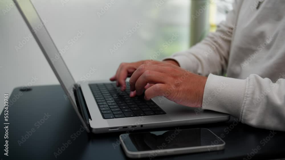 Person typing on a Laptop Detail Person typing on a Laptop Detail