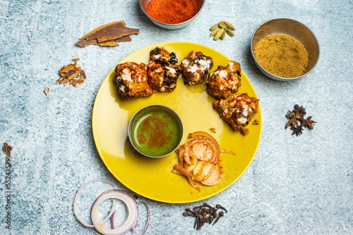 Beef tikka boti kabab with chili sauce served in a dish isolated on grey background top view of bangladesh food photo