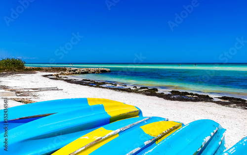 Canoes boats for water activities on the beach Holbox Mexico.