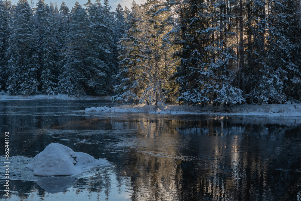 Frosty cold winter day in a river landscape. Farnebofjarden national park in north of Sweden.