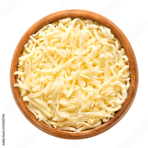 Shredded mozzarella cheese, in a wooden bowl. Grated low-moisture part-skim mozzarella, an Italian cheese, made of pasteurized cow milk, rolled in starch to avoid sticking. Used for pizza and pasta.