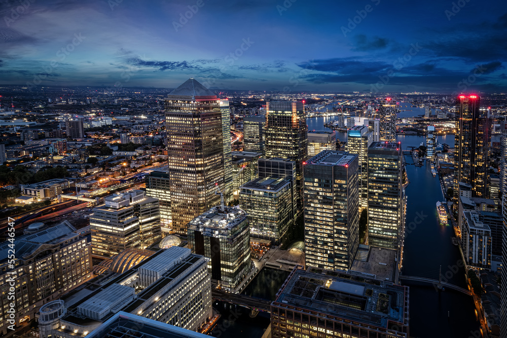 Elevated view of the illuminated office skyscrapers at Canary Wharf, London, during evening