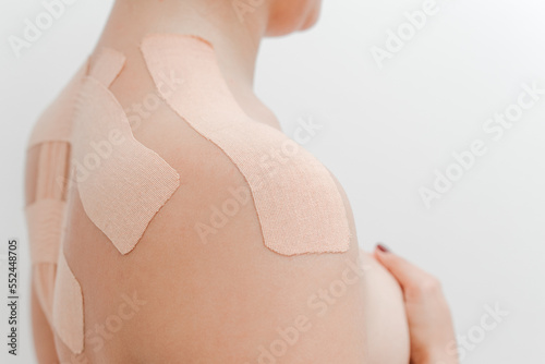 Canvas Print Women's body with kinesio tape on the back and shoulders