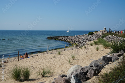 Beach with people resting on the Baltic Sea in the village of Hel in northern Poland.