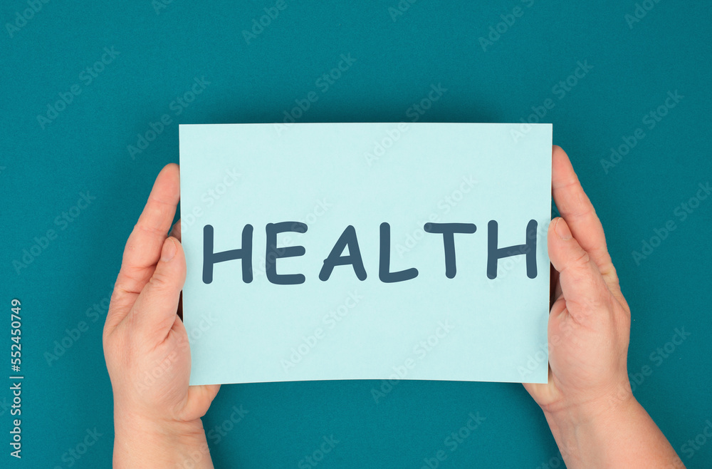 Health is standing on the paper, healthy lifestyle, medical care, prevention and insurance concept Health is standing on the paper, healthy lifestyle, medical care, prevention and insurance concept