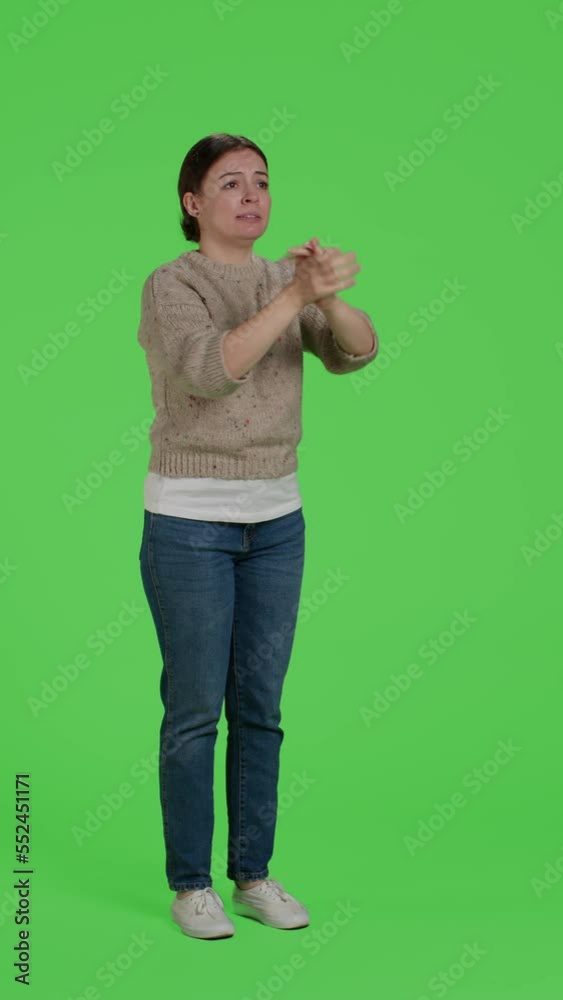 Vertical video: Side view of young adult doing standing ovation and saying congratulations in studio, applauding or clapping hands. Cheerful caucasian woman celebrating success and support Vertical video: Side view of young adult doing standing ovation and saying congratulations in studio, applauding or clapping hands. Cheerful caucasian woman celebrating success and support