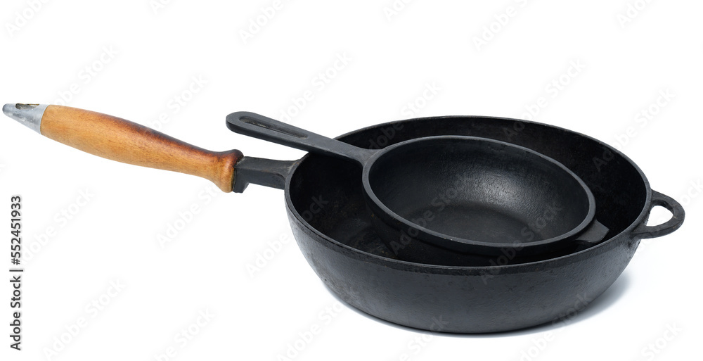 Empty black round metal pan on a white isolated background Empty black round metal pan on a white isolated background