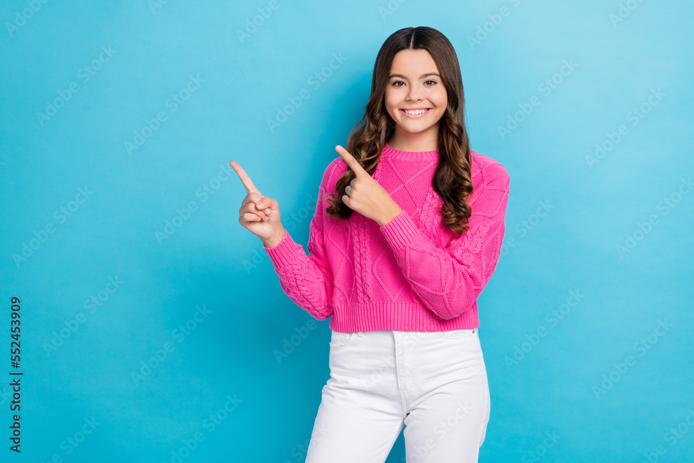 Photo of pretty positive lady wear trendy pink clothes two arm direct empty space buy quality device isolated on blue color background