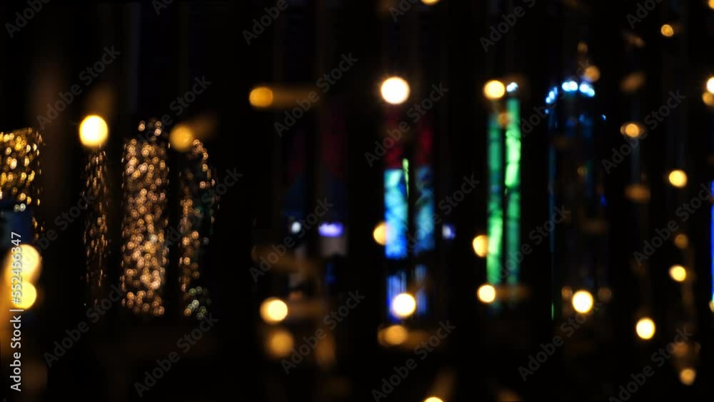 Christmas Lights Defocused With Silhouettes of People Walking Christmas Lights Defocused With Silhouettes of People Walking
