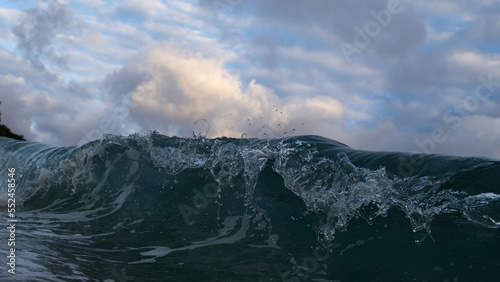 Close-up view of wave breaking on the coast.