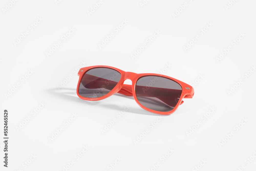 Fototapeta premium Red sunglasses on white background