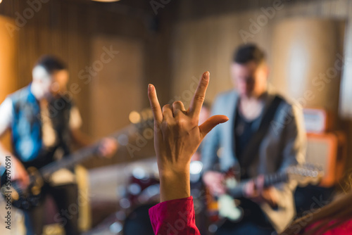 Hand raised showing a heavy metal rock sign. High quality photo