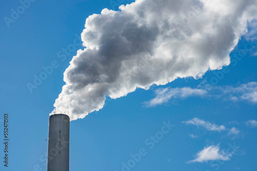Industrial chimney  thermal power plant  pollution in the air  steam cooling tower in Graz  Styria region  Austria.