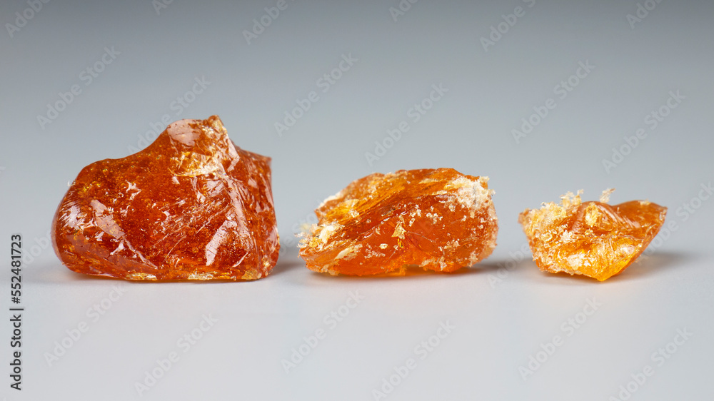 3 pieces of cannabis wax closeup. concentrate dab with high thc 3 pieces of cannabis wax closeup. concentrate dab with high thc