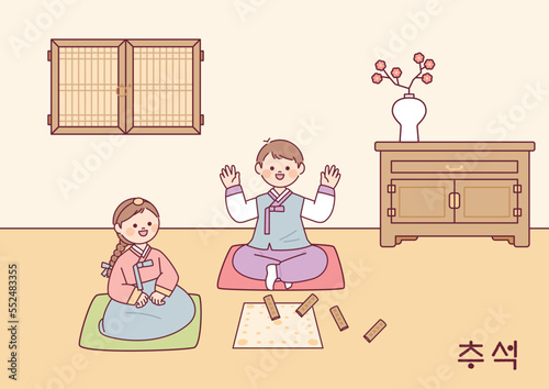 Korean traditional game. Two friends are playing Yut in their room. Korean traditional room.