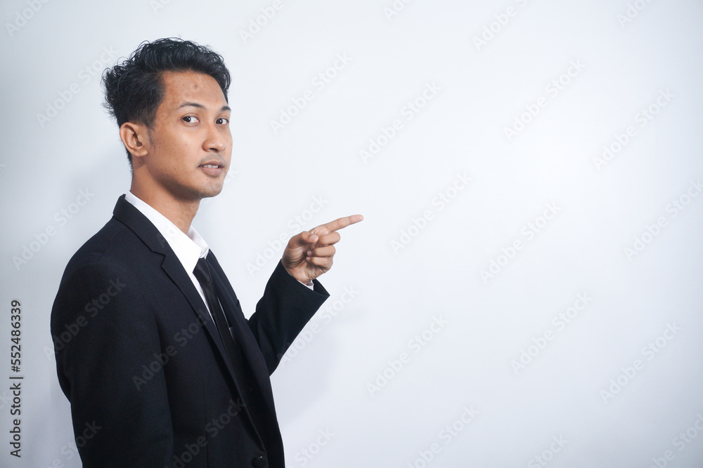 Portrait of smart confident man entrepreneur company owner point index finger suggest select promo adverts advertise ads wear formalwear outfit isolated over grey color background Portrait of smart confident man entrepreneur company owner point index finger suggest select promo adverts advertise ads wear formalwear outfit isolated over grey color background