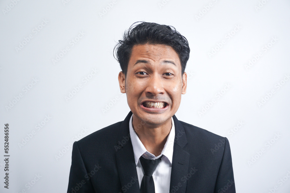 Portrait of an angry man wearing suit