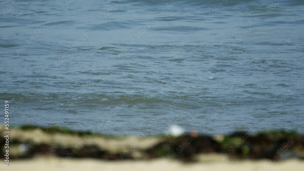 Close up of beach sea waves rolling in summer Close up of beach sea waves rolling in summer