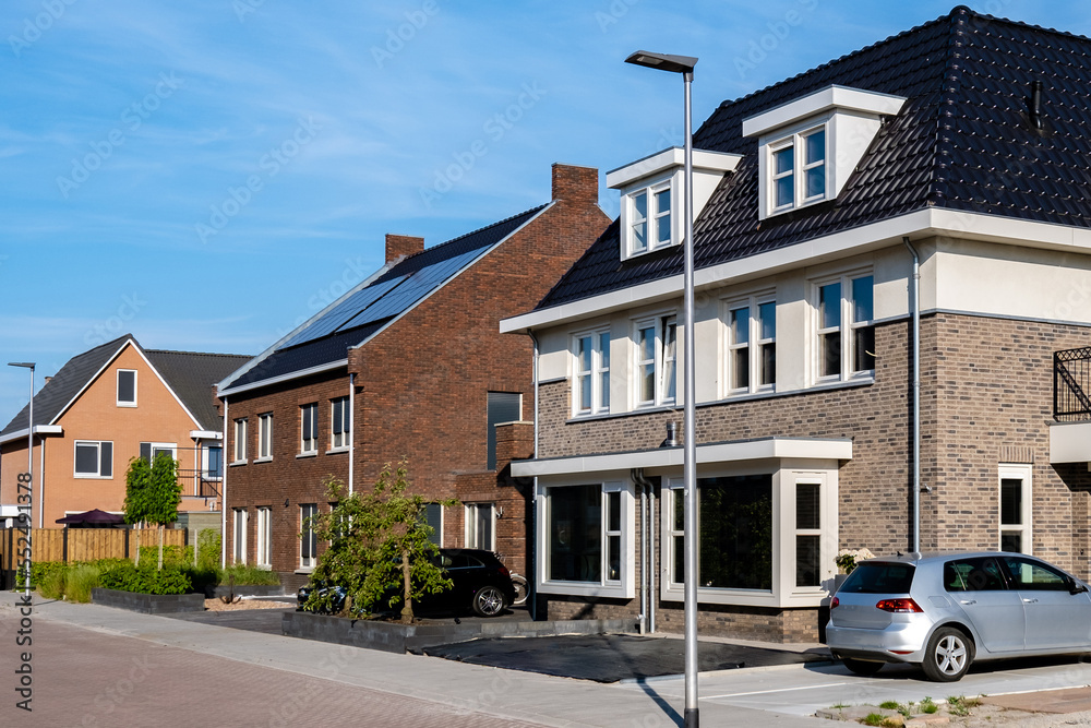 Dutch Suburban area with modern family houses, newly build modern family homes in the