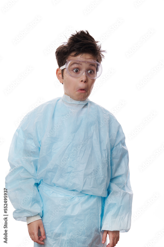 Waist-length emotional portrait on white background of a nerd school kid, stupefied shocked Caucasian teenage boy, young chemist scientist wearing lab coat and safety goggles, expressing astonishment Waist-length emotional portrait on white background of a nerd school kid, stupefied shocked Caucasian teenage boy, young chemist scientist wearing lab coat and safety goggles, expressing astonishment