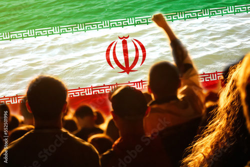Defocus protest in Iran. Conflict war over border. World crisis. Country flag. Woman low rights. Male hands. Out of focus