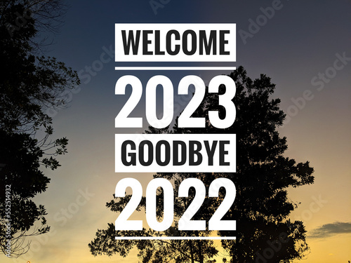 Sunrise and nature background with text WELCOME 2023 GOODBYE 2022. New year concept.