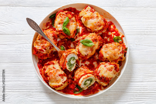 tasty chicken rollatini in tomato sauce, top view