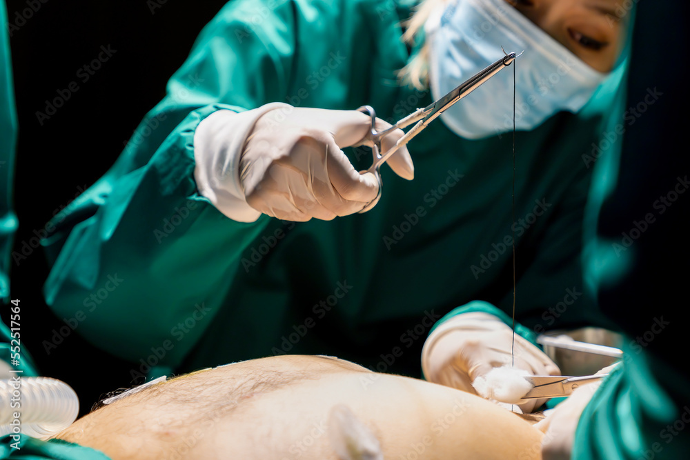 A team of professional doctors perform surgery in a hospital, a group of surgeons working in the operating theater.