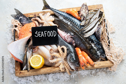 Fresh fish and seafood arrangement. Healthy eating concept. Top view..
