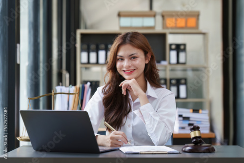 Lawyer working at office. Asian Lawyer doing with contract or document in office. Law, legal services, advice, Justice and real estate concept
