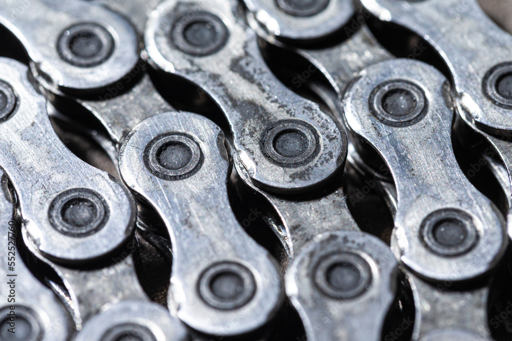 Extreme Closeup View of Dirty Greasy Oiled Bicycle Chain As A Part of Metal Bicycle Equipment On Stony Background With Contrast Details Extreme Closeup View of Dirty Greasy Oiled Bicycle Chain As A Part of Metal Bicycle Equipment On Stony Background With Contrast Details