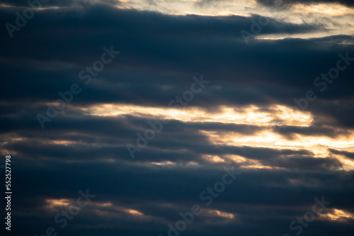 Dramatic sky. Clouds at sunset. Clouds in the light of the setting sun.