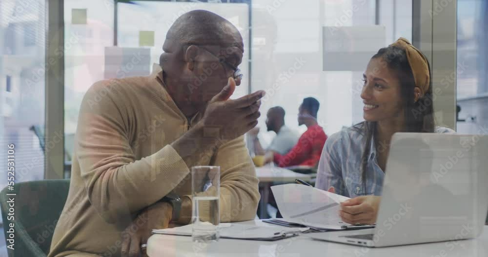 Animation of data processing over diverse business people at office
