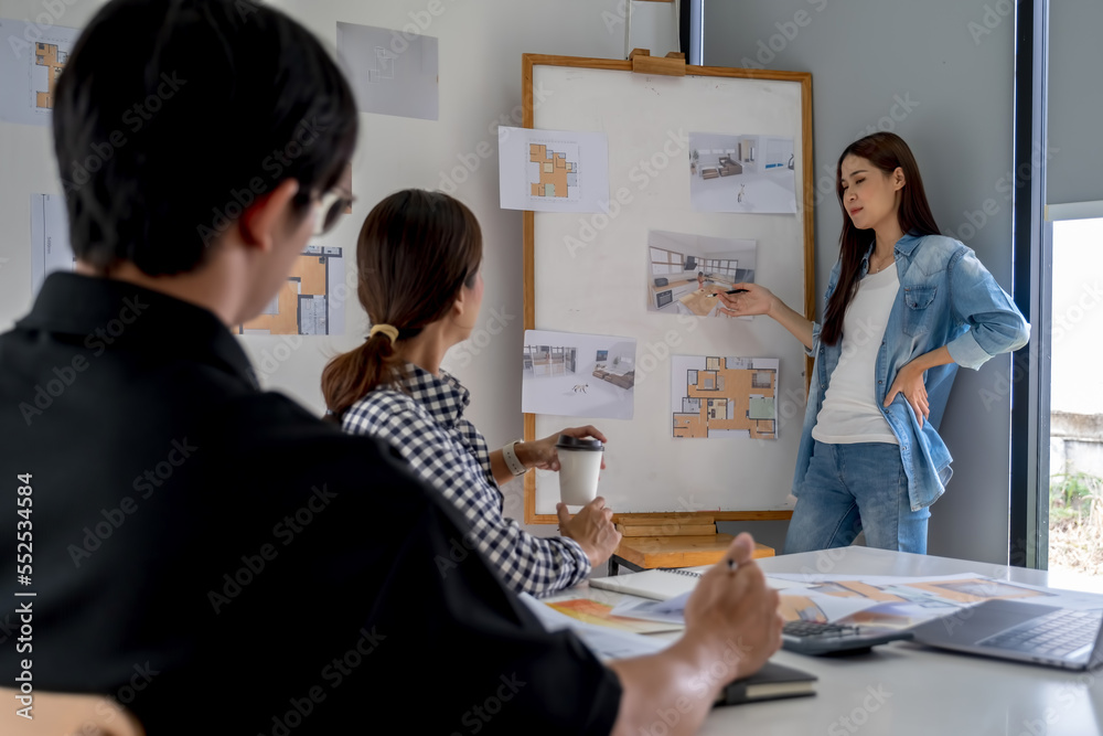 Obraz premium Architect design works drawing sketches, plans, blueprints and building architectural construction models in an architect studio.