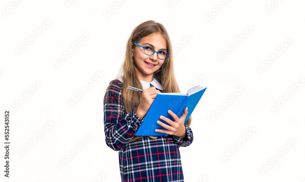 smiling school girl noting notes in studio. school girl noting notes. photo of school teen smiling school girl noting notes in studio. school girl noting notes. photo of school teen