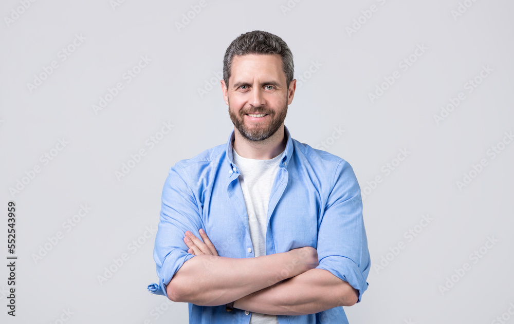 positive caucasian man wearing casual shirt. caucasian man in casual style isolated on grey positive caucasian man wearing casual shirt. caucasian man in casual style isolated on grey