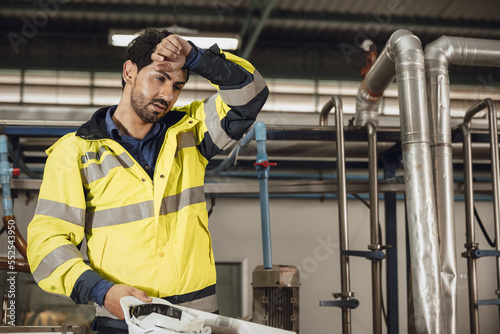 tired engineer worker hard work fatigue male staff in factory hot weather