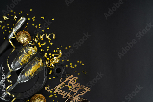 Canvas Print Dumbbell weight plate, golden decorations, confetti, champagne glasses, party streamers for New Year's Eve celebration