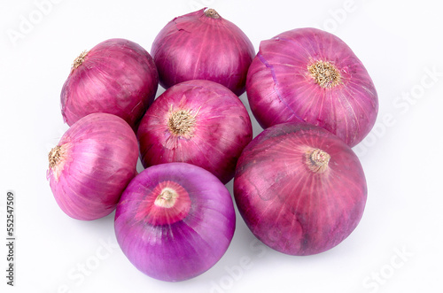 Group of Indian red whole onions isolated on white background
