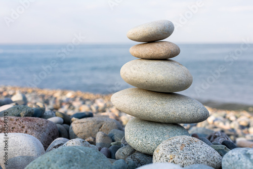 Stack of zen stones in harmony and balance with sea view