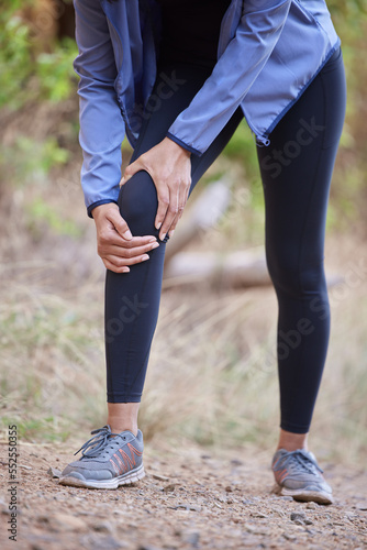 Fitness, knee pain and hands massage of woman in forest hiking, workout or running accident and body zoom for health insurance. Legs injury, joint pain or arthritis of athlete, runner in medical risk