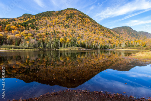 Fall colors reflections at Jacques Cartier National Park. Quebec. Canada.